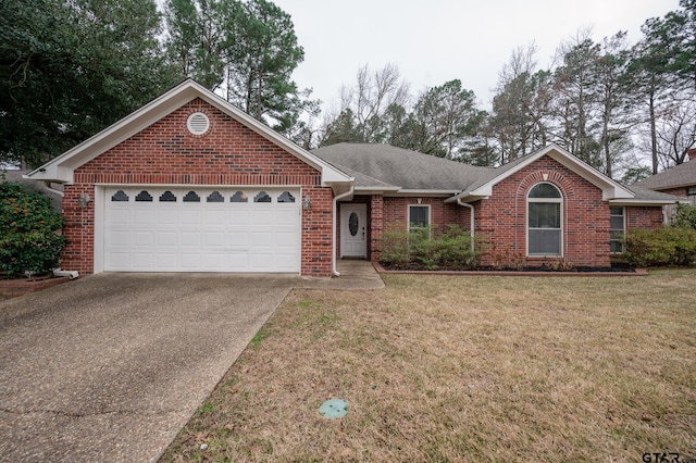 view of front of home featuring a garage and a front lawn