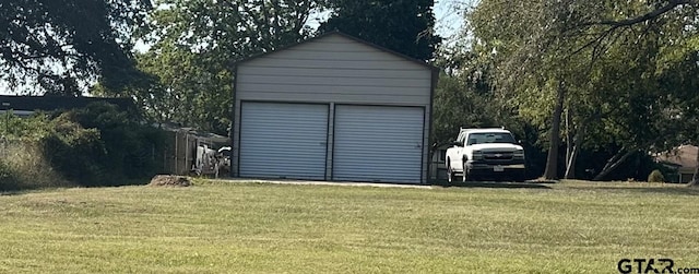 view of outbuilding featuring a lawn