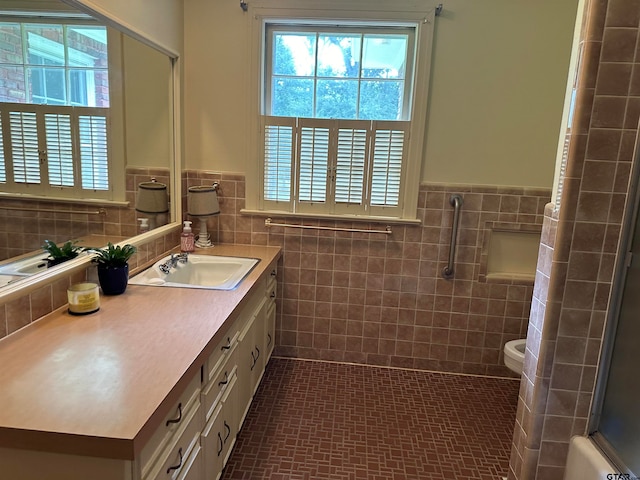 full bathroom featuring tile walls, vanity, shower / tub combination, and toilet