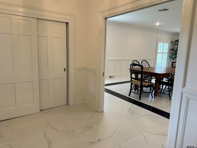 dining area with crown molding