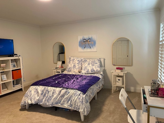 bedroom with carpet and ornamental molding