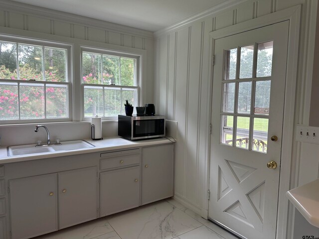 doorway with plenty of natural light and sink