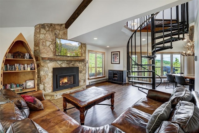 living room with vaulted ceiling with beams, dark hardwood / wood-style floors, a stone fireplace, and baseboard heating