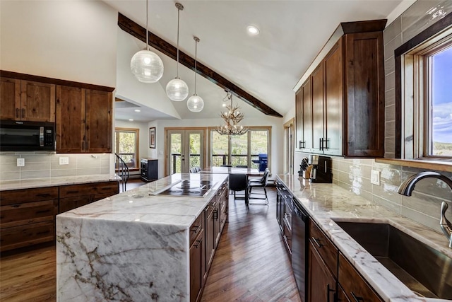 kitchen with black appliances, sink, decorative backsplash, a kitchen island, and beam ceiling