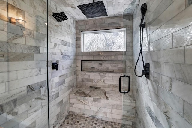 bathroom with a shower with shower door