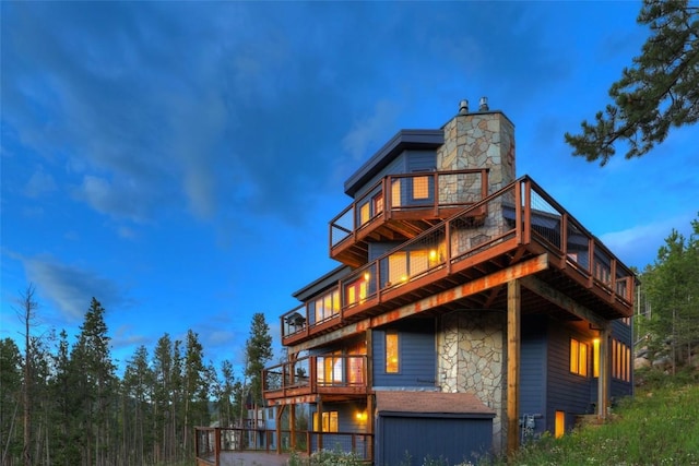 view of back house at dusk