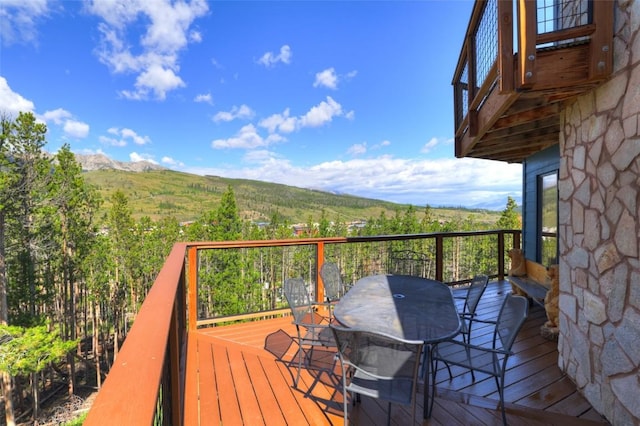 wooden terrace featuring a mountain view