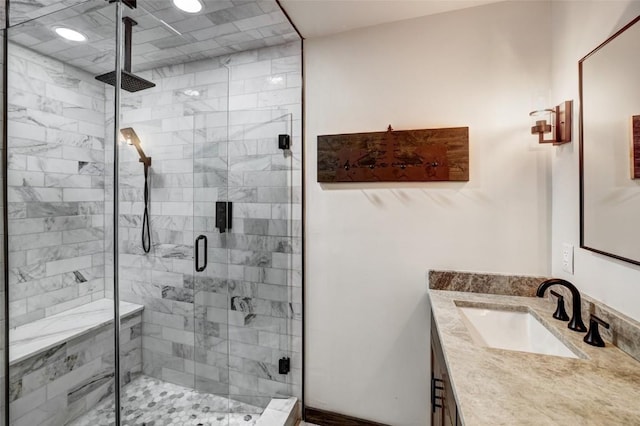 bathroom with vanity and a shower with door