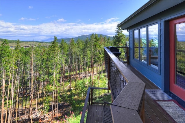 wooden terrace with a mountain view