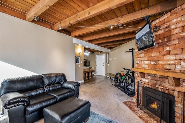 living room with beamed ceiling, carpet flooring, wooden ceiling, and a fireplace