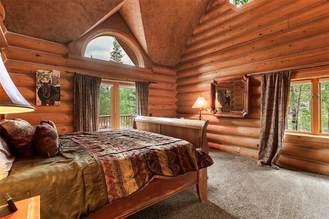 carpeted bedroom featuring multiple windows, access to outside, high vaulted ceiling, and rustic walls