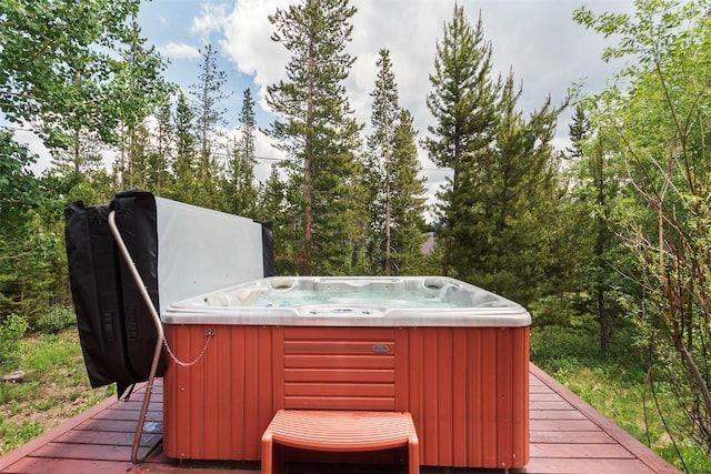 wooden terrace featuring a hot tub