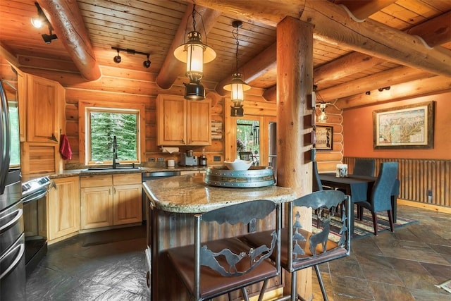 kitchen featuring pendant lighting, stone countertops, wood ceiling, and sink