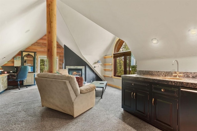 living room featuring a healthy amount of sunlight, sink, light colored carpet, and vaulted ceiling