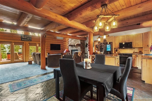 dining room with log walls, a fireplace, beamed ceiling, and wood ceiling