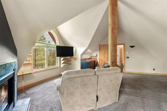 living room with carpet, vaulted ceiling, and a tiled fireplace