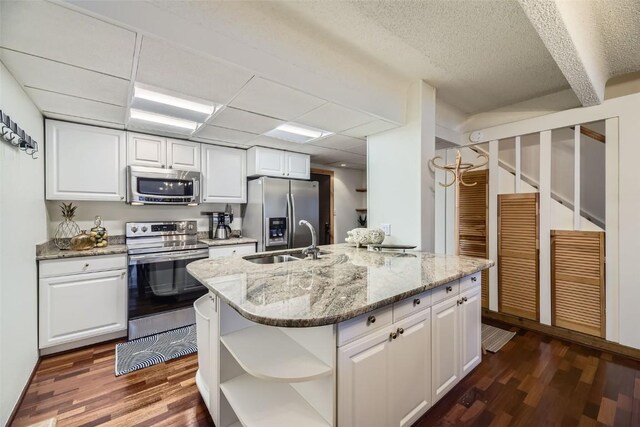 kitchen featuring sink, white cabinetry, and stainless steel appliances