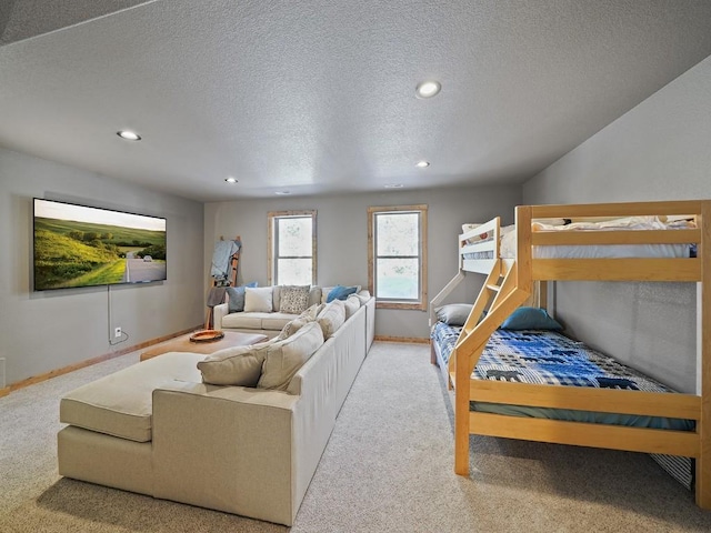 carpeted bedroom with a textured ceiling