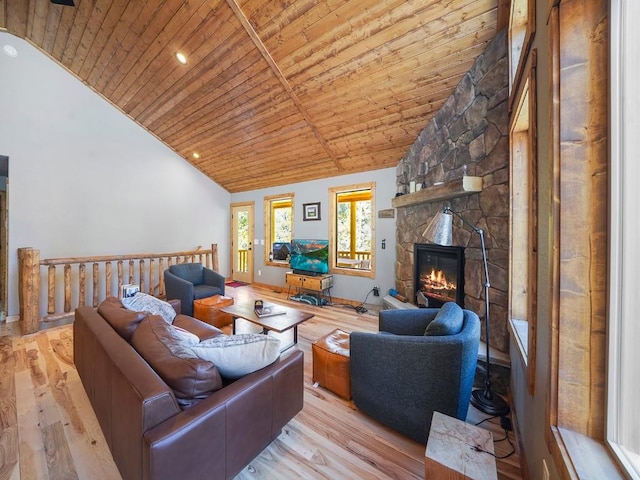 living room with light wood-type flooring, a stone fireplace, wooden ceiling, and high vaulted ceiling