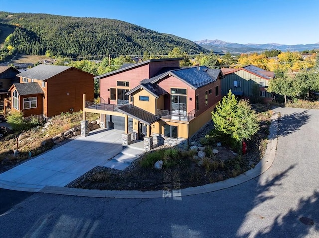 birds eye view of property with a mountain view