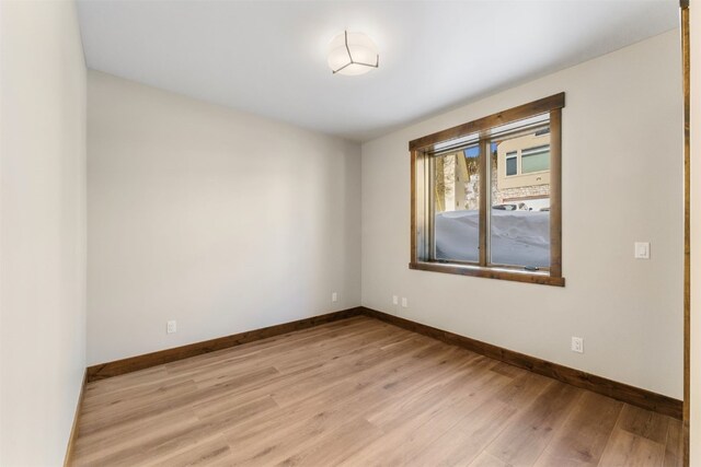 spare room featuring light hardwood / wood-style floors