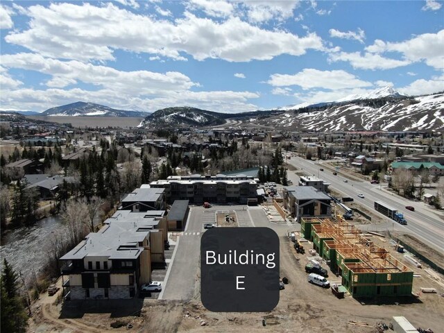 birds eye view of property with a mountain view