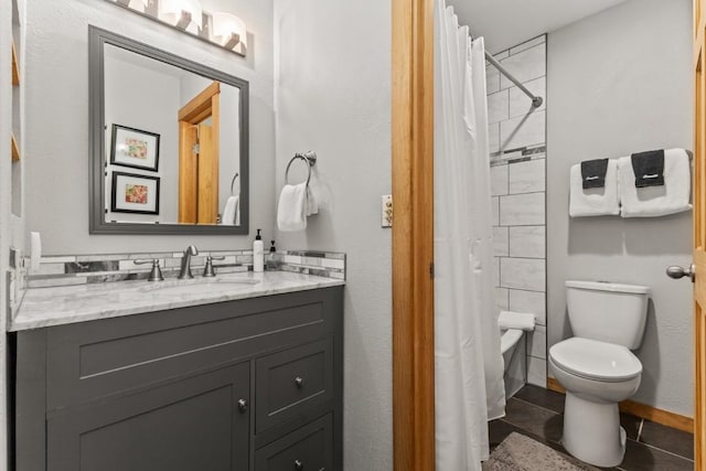 full bathroom featuring shower / bathtub combination with curtain, vanity, toilet, and tile patterned floors