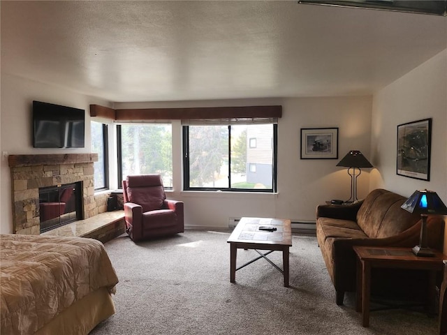 carpeted living room featuring a fireplace and baseboard heating