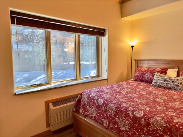 bedroom featuring wood ceiling and dark hardwood / wood-style floors