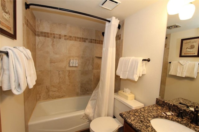 full bathroom with vanity, shower / bath combination with curtain, and toilet