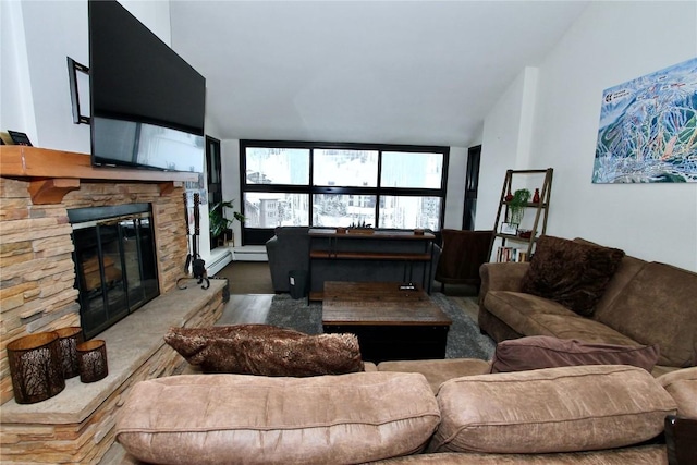 living room with a stone fireplace