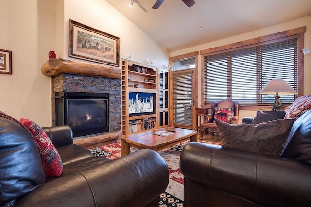 living room with track lighting, ceiling fan, built in features, a fireplace, and lofted ceiling