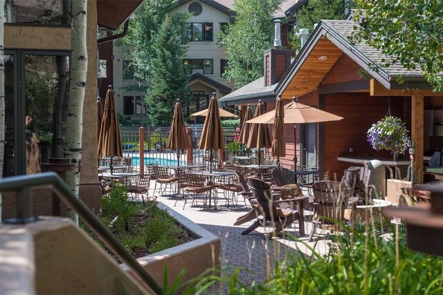 view of patio / terrace featuring a community pool