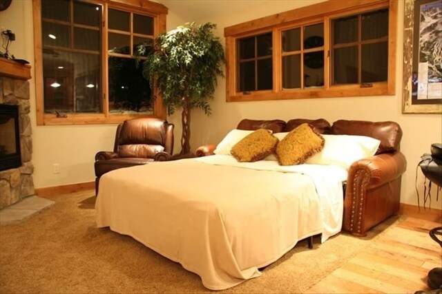 bedroom featuring a fireplace