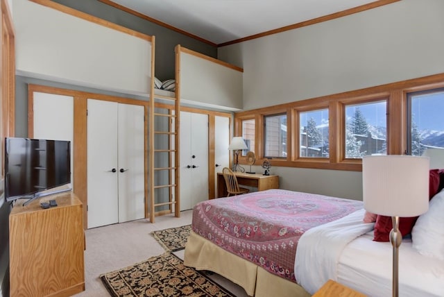 bedroom featuring light carpet, french doors, a high ceiling, and crown molding