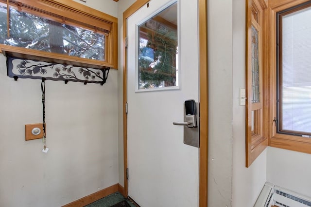 entryway featuring baseboards