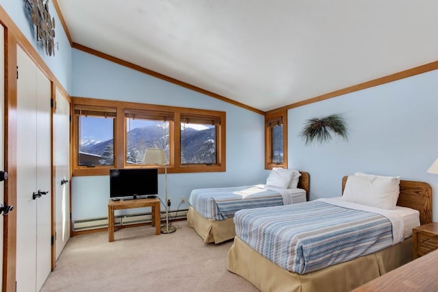 bedroom featuring light carpet, a baseboard heating unit, vaulted ceiling, and crown molding