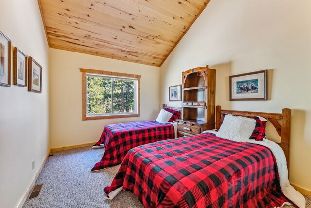 carpeted bedroom featuring high vaulted ceiling and wooden ceiling