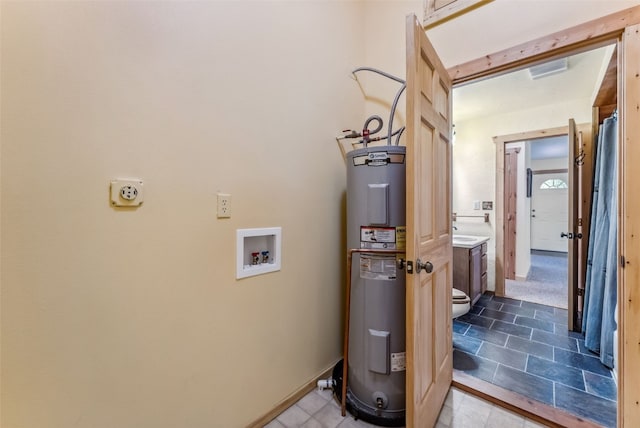 utility room with electric water heater