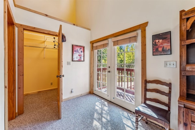 entryway featuring french doors and carpet floors