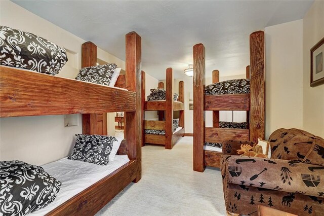 bedroom featuring light colored carpet