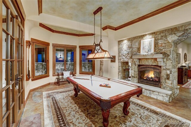 recreation room with french doors, billiards, and a stone fireplace