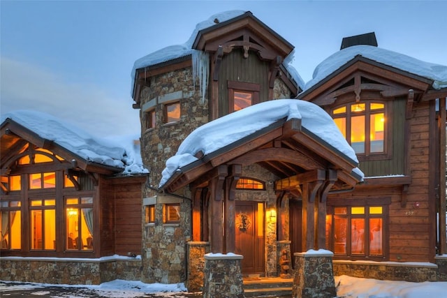 view of snow covered house