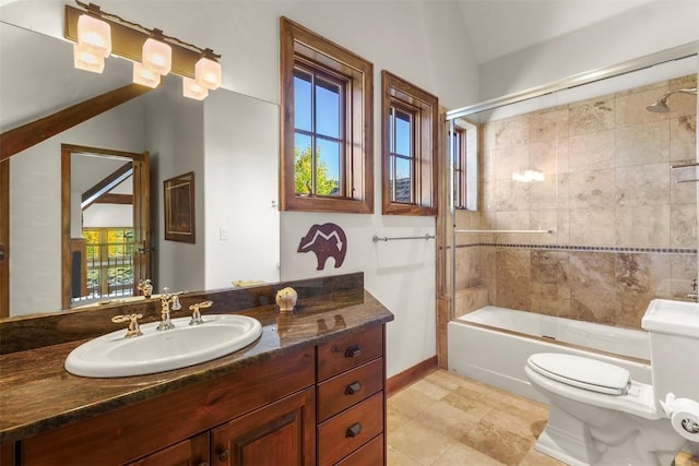 full bathroom with shower / bath combination with glass door, vanity, toilet, and lofted ceiling