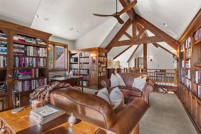 living area with beamed ceiling, light carpet, high vaulted ceiling, and ceiling fan