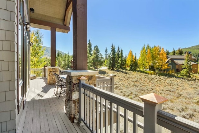 wooden deck featuring a mountain view