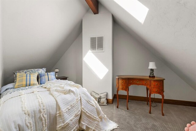 bedroom with lofted ceiling with skylight and light carpet