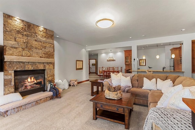 living room featuring carpet flooring and a fireplace