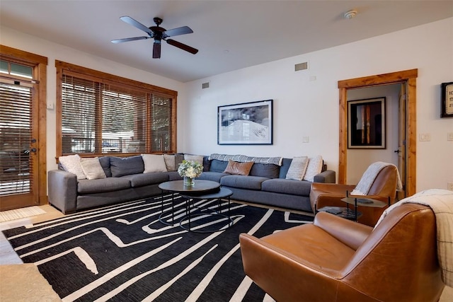 living room with carpet flooring and ceiling fan