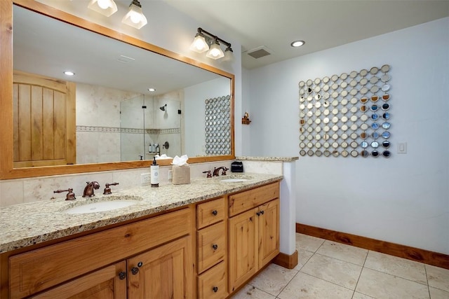 bathroom with tile patterned floors, a shower with shower door, and vanity